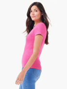 Pink ribbed knit short sleeve crew tee. Fitted, shown on a model.