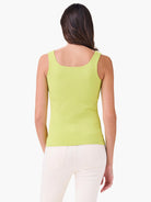 Lime green fitted tank top, square back neckline, sleeveless. Worn by a woman facing away.