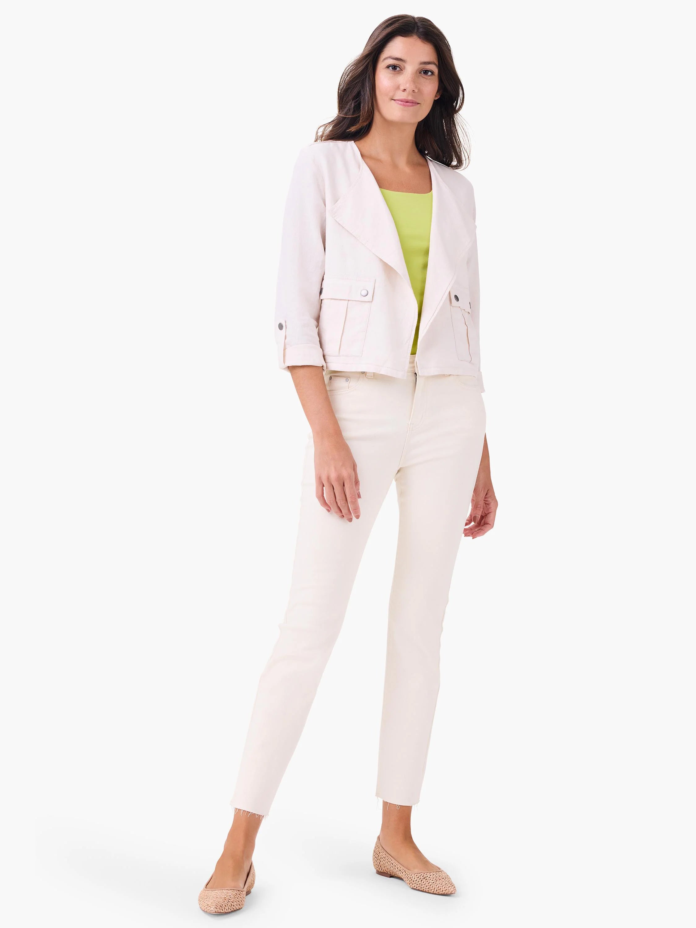 Bright lime green sleeveless tank top with a wide U-neck, partially visible under an open jacket.