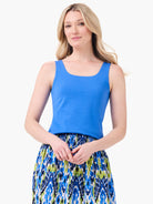 Solid blue tank top with a square neckline and wide straps.
