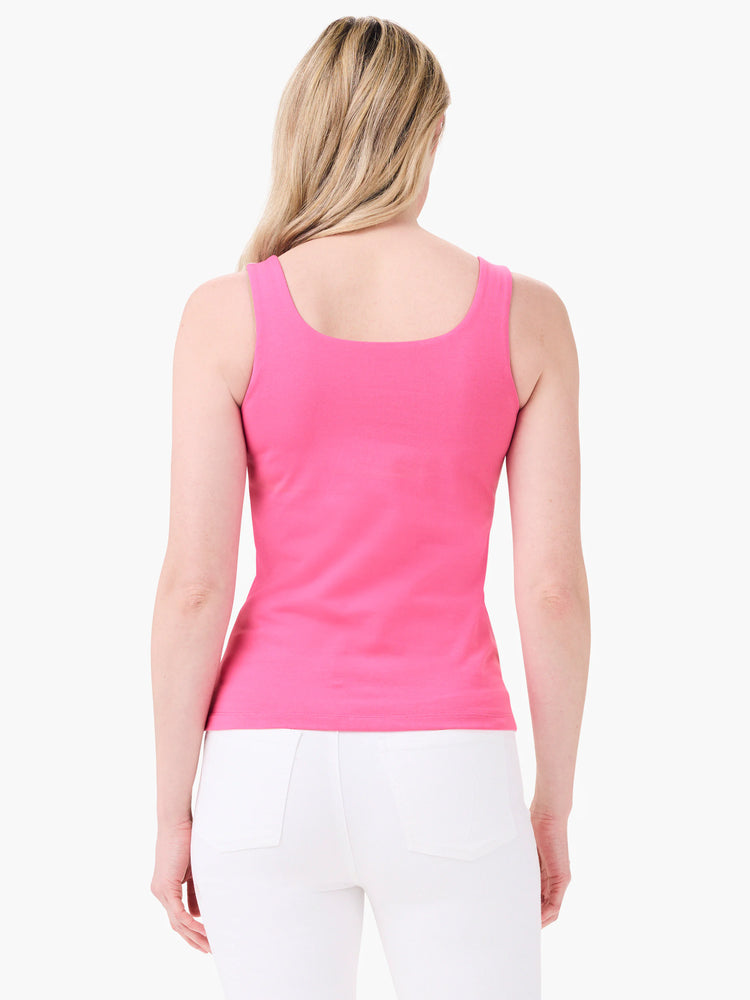Rear view of a bright pink tank top on a model. It has wide straps and a scoop back neckline, fitted.