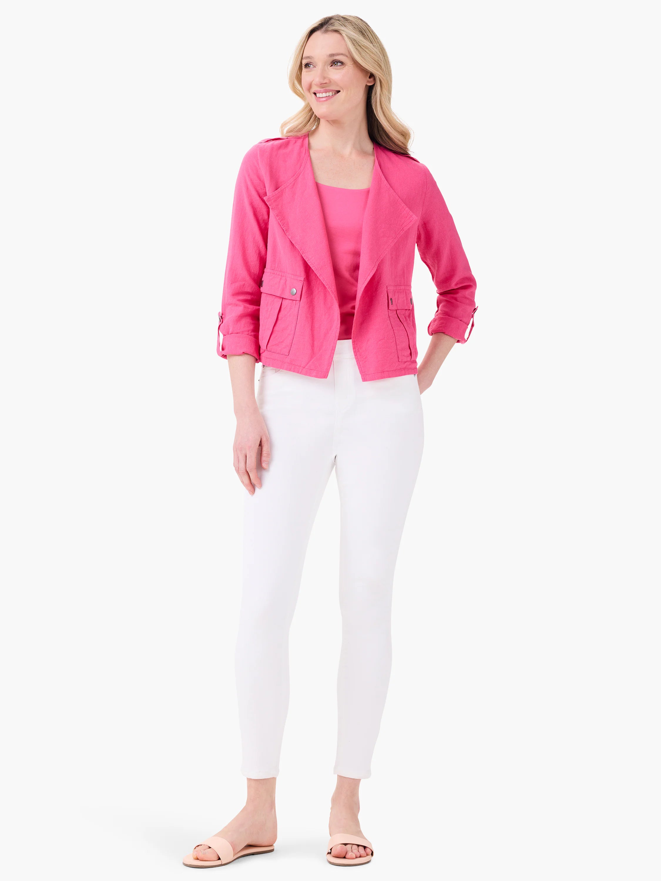 Bright pink scoop neck tank top worn by a model, partially visible under an open pink jacket.