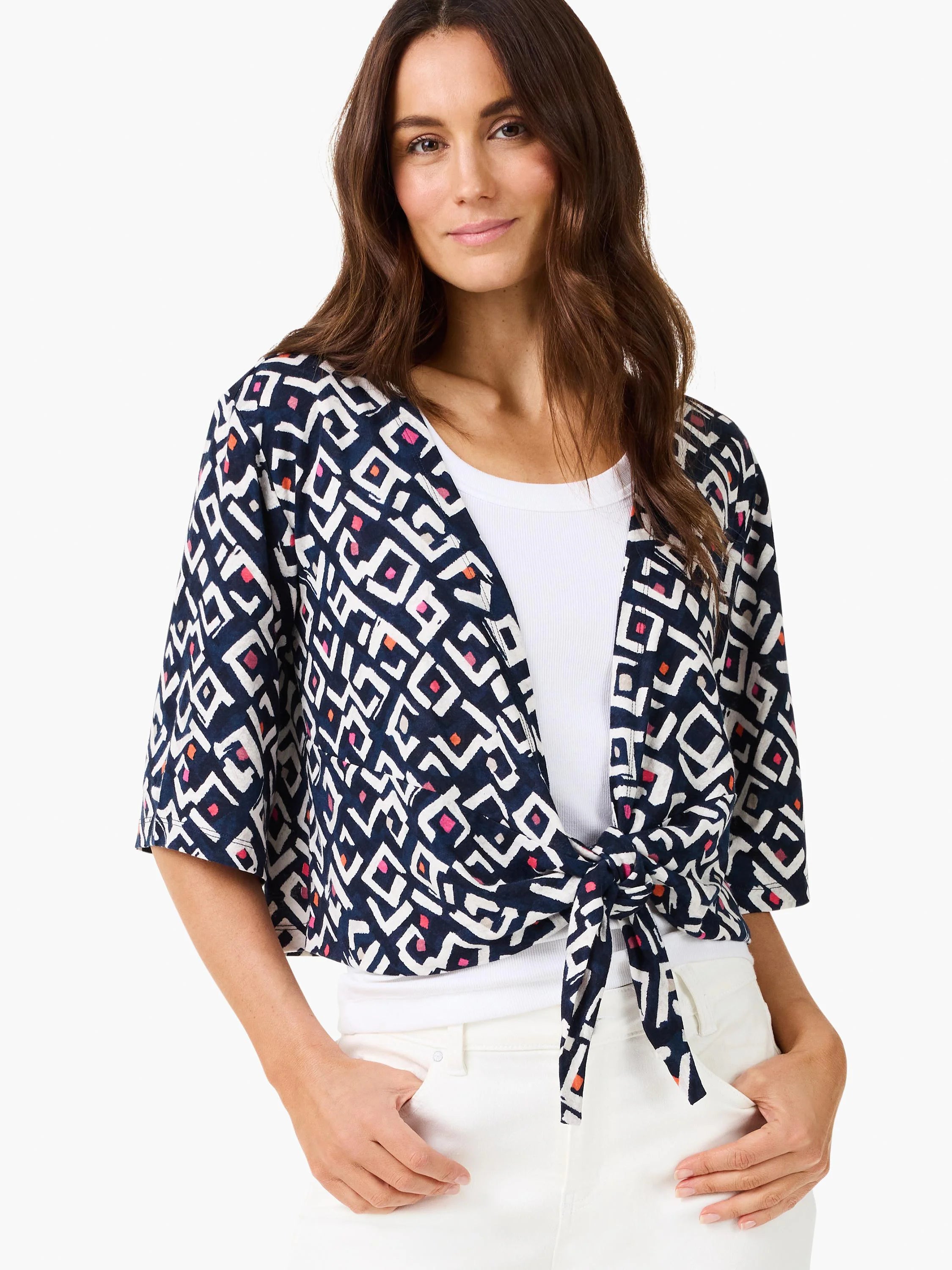 Indigo cardigan with white geometric pattern, pink/orange accents, tied at front, and short sleeves.