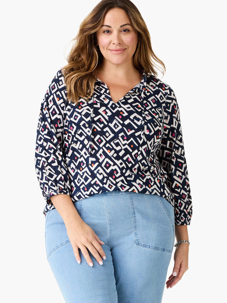Top features indigo, white, pink, and orange geometric pattern, V-neck with ties, and 3/4 sleeves.