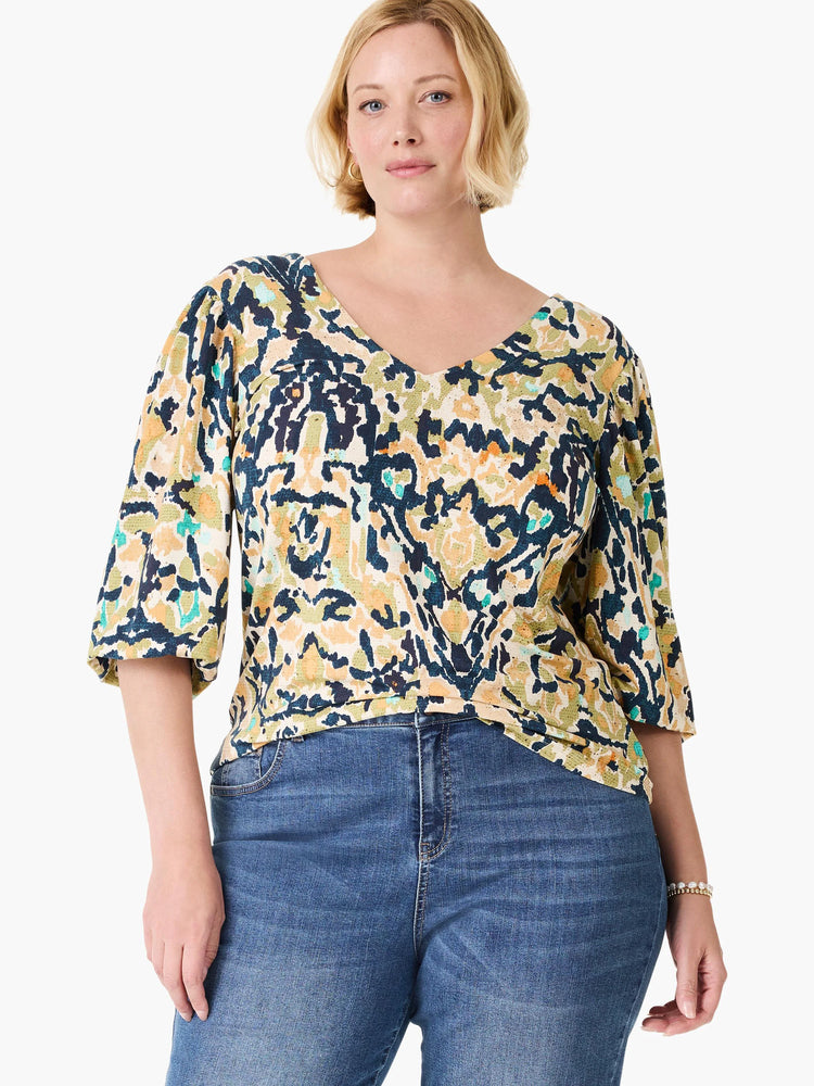 V-neck top with cream, navy, olive, yellow, and teal abstract pattern. 3/4 sleeves.