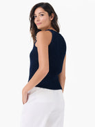 Dark blue sleeveless high neck tank with a visible knitted tape yarn texture and ribbed hem.