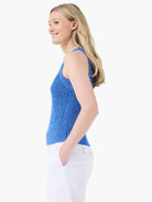 Bright blue knitted tank top with a high neck and tape yarn texture. Sleeveless.