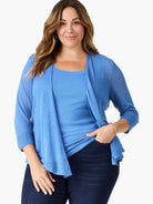 Medium blue, open-front cardigan with 3/4 sleeves and ribbed cuffs. Features a sheer, fine-knit fabric.