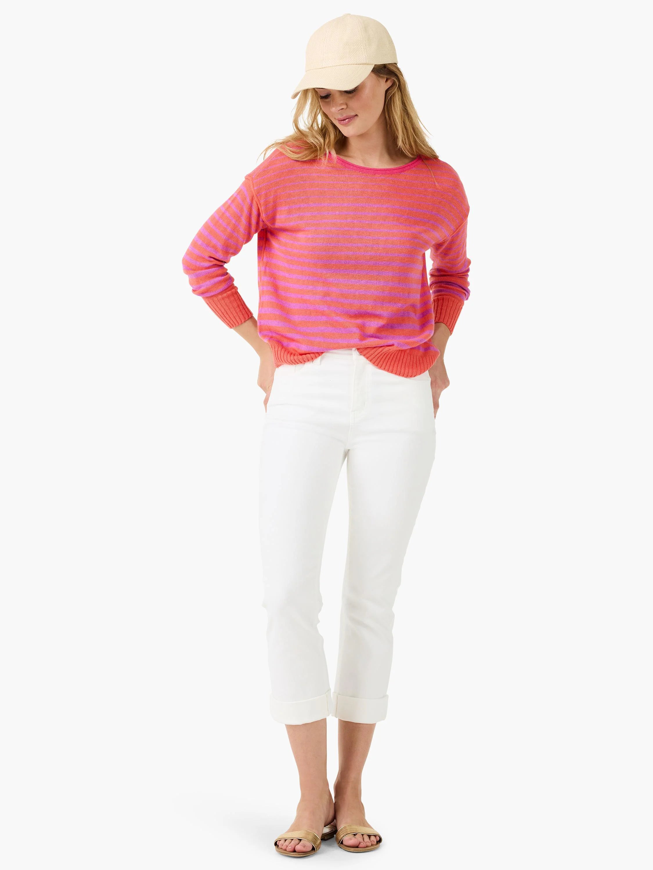 Sweater with coral orange and fuchsia pink horizontal stripes, ribbed crew neck, hem, and cuffs.