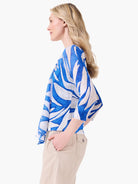 Meadow Mix Cardigan: blue and white organic pattern, 3/4 sleeves, worn open.