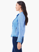 Blue & white mixed knit jacket with fringed collar, hem, and cuffs. Features a side zipper pocket and cuff buttons.