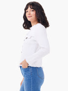 White textured knit jacket with fringe edges, dark front buttons, and button-flap chest pockets.