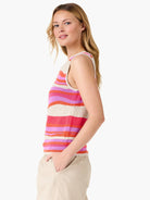 Knit tank top with wavy horizontal stripes in cream, fuchsia, lavender-pink, and coral.