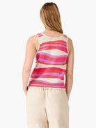 Wavy striped knit tank top in cream, fuchsia, magenta, and coral. Seen from the back.