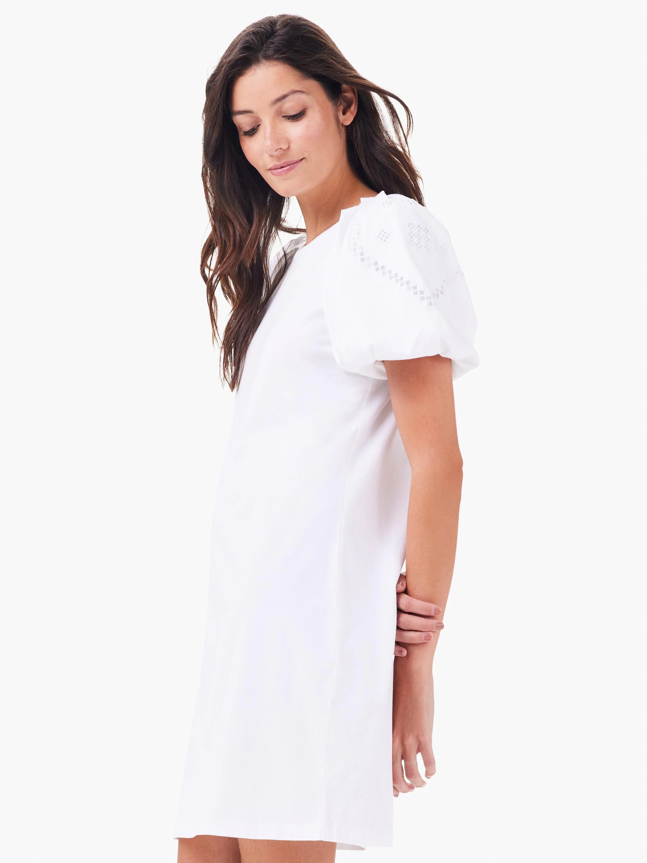 White T-shirt dress with puffed sleeves featuring geometric eyelet embroidery. Round neck, straight fit.
