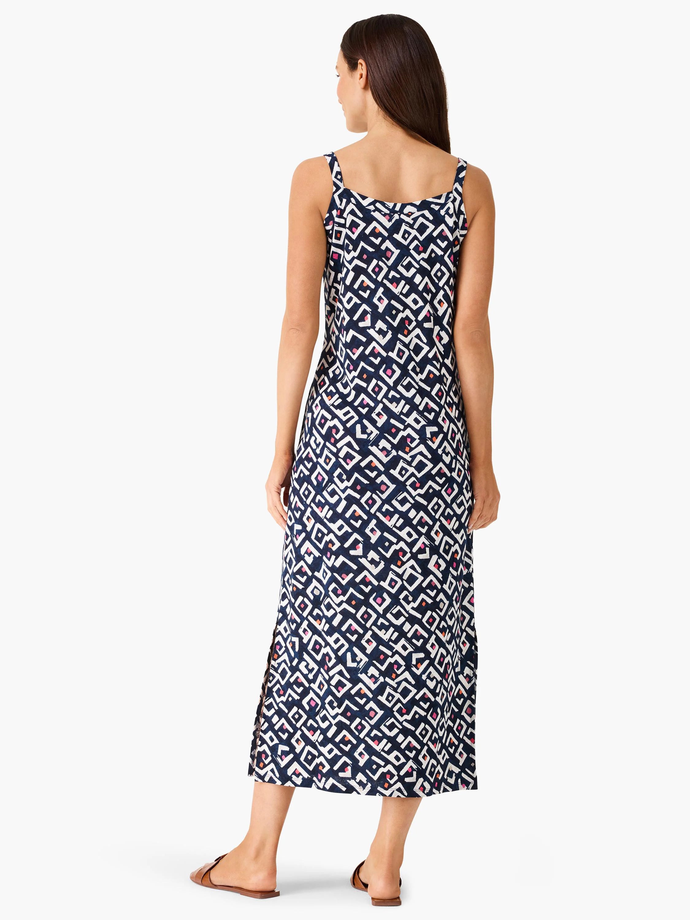 Indigo maxi dress with thin straps, featuring a geometric pattern in white, pink, and orange accents.