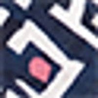 Dark blue textured fabric with raised white patterns, detailed with a small pink stitch.