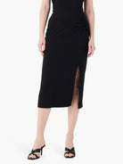Black jersey midi sarong skirt with a ruched side knot and a side slit.