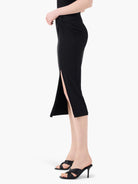 Black jersey sarong skirt, midi length, with a knotted side waist detail and a high thigh slit.