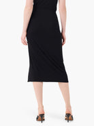 Black jersey sarong midi-skirt, form-fitting with a smooth finish.