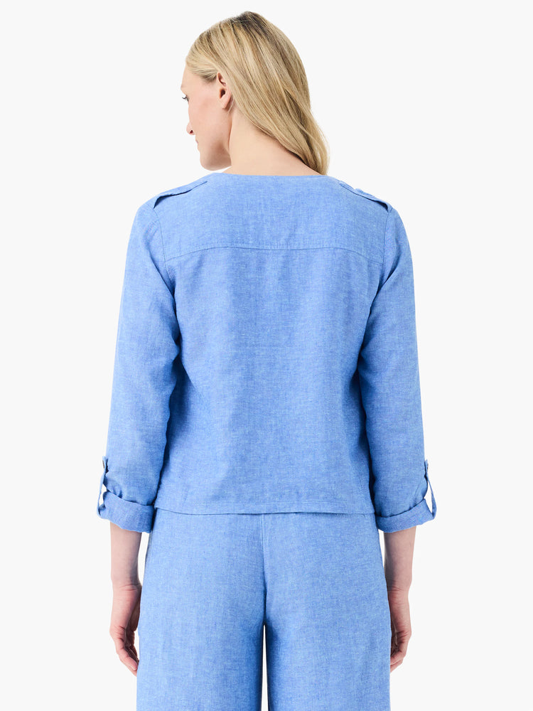 Light blue linen jacket, back view. Features shoulder epaulets and cuffed 3/4 sleeves with tabs.