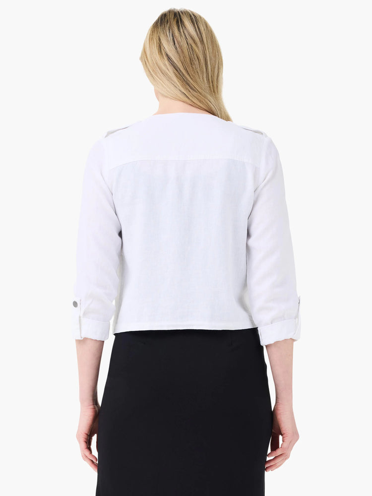 White linen moto jacket, back view. Features 3/4 rolled sleeves with buttoned tabs, and shoulder tabs.