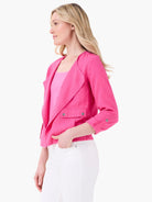 Vibrant pink linen moto jacket with draped lapels, two front patch pockets with silver snaps, and rolled sleeves with...