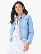 Light blue faded denim jacket with frayed hem and shoulder fringe details.