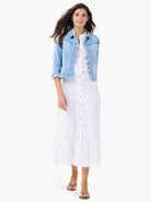 Light blue denim jacket with fringe details on seams, cropped length, and 3/4 sleeves.