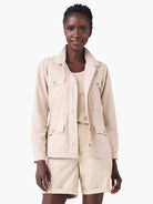 Light beige poplin jacket with a collared neck, button front, four button-flap pockets, and a cinched drawstring waist.