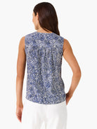 Sleeveless blue & white tank with irregular dot pattern and pleats below the back neckline.