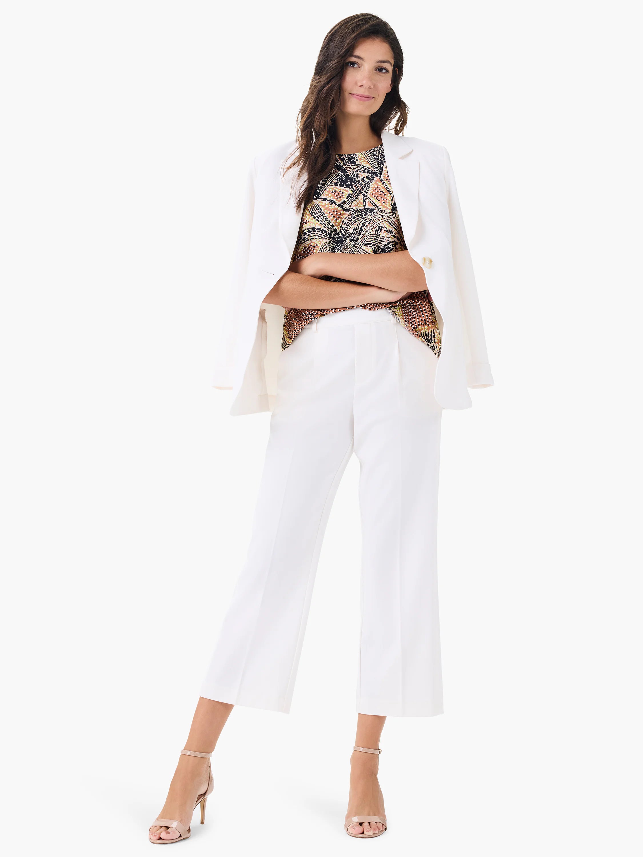 Sleeveless tank featuring a black, peach, and cream abstract dotty palm print.