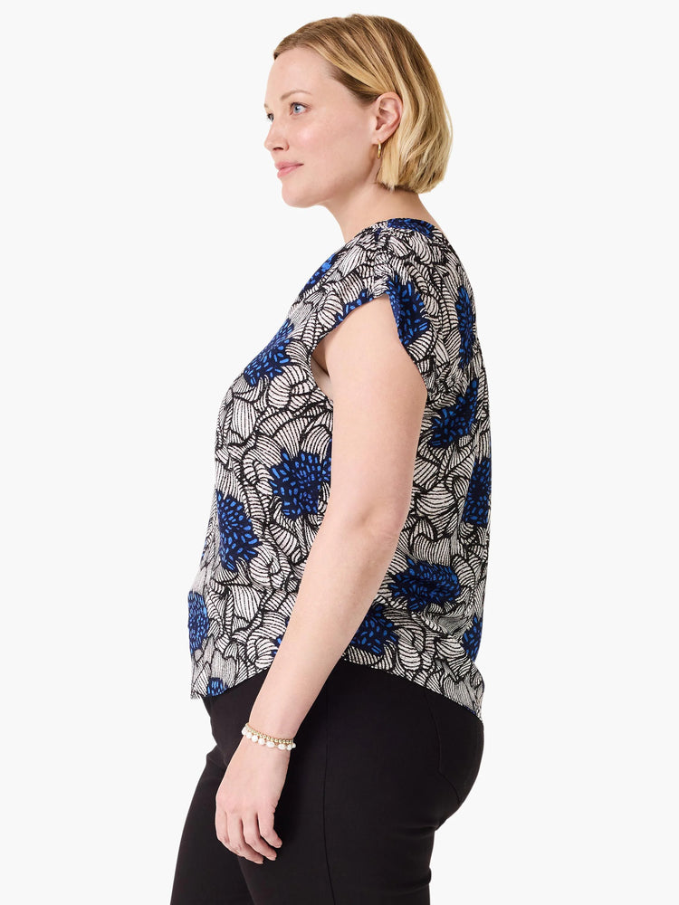 Blue, white, and black abstract floral top with loose fit and cap sleeves.