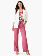 Sleeveless V-neck tank with an abstract pattern of magenta and cream block shapes.