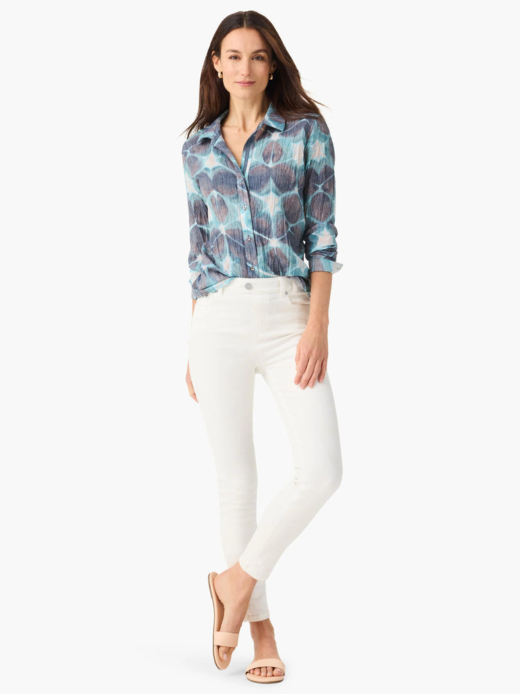 Crinkled button-up shirt with an abstract tie-dye pattern in shades of blue, teal, and muted brown.