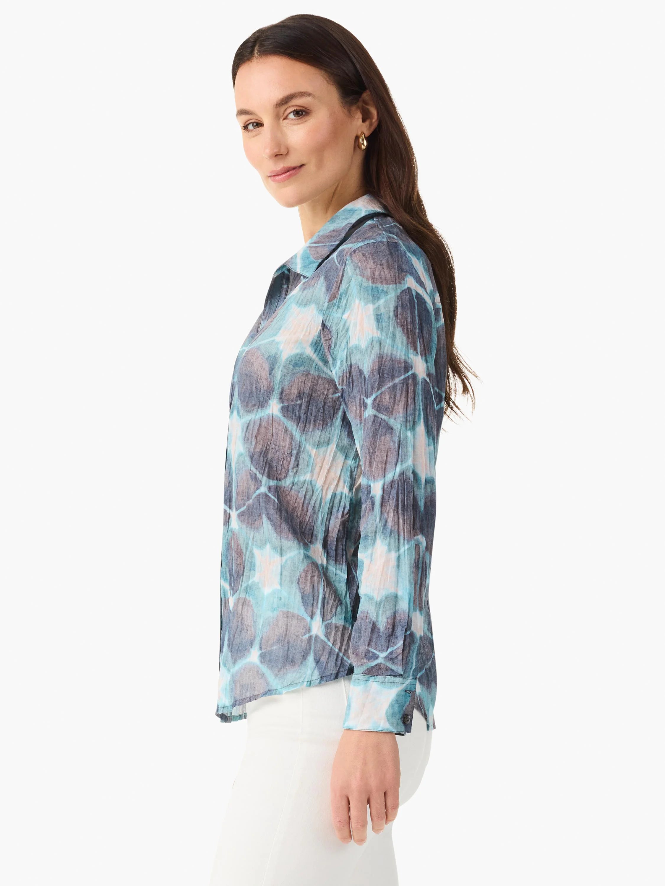 Crinkled shirt with abstract turquoise, navy, and tan pattern.