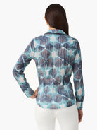 Crinkled long-sleeve shirt with an abstract blue, aqua, and off-white tie-dye pattern.