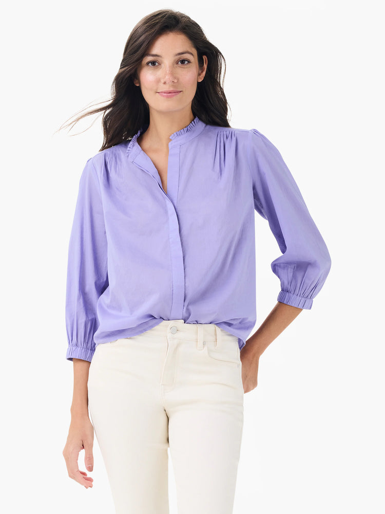 Lavender cotton shirt with gathered stand collar, pleated shoulders, and 3/4 length elasticized sleeves.