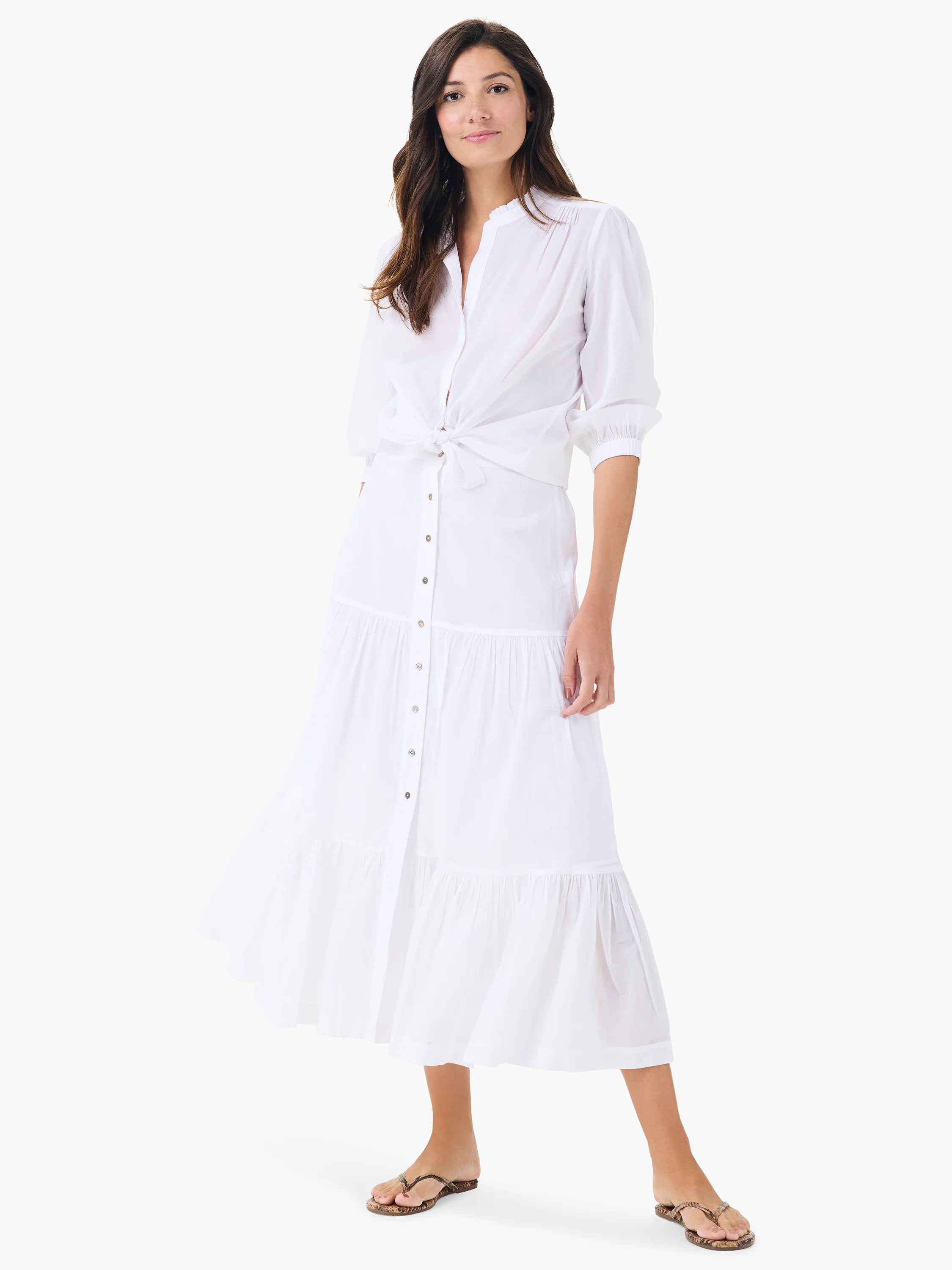 White shirt with band collar, 3/4 sleeves with gathered cuffs, tied in a knot at the waist.