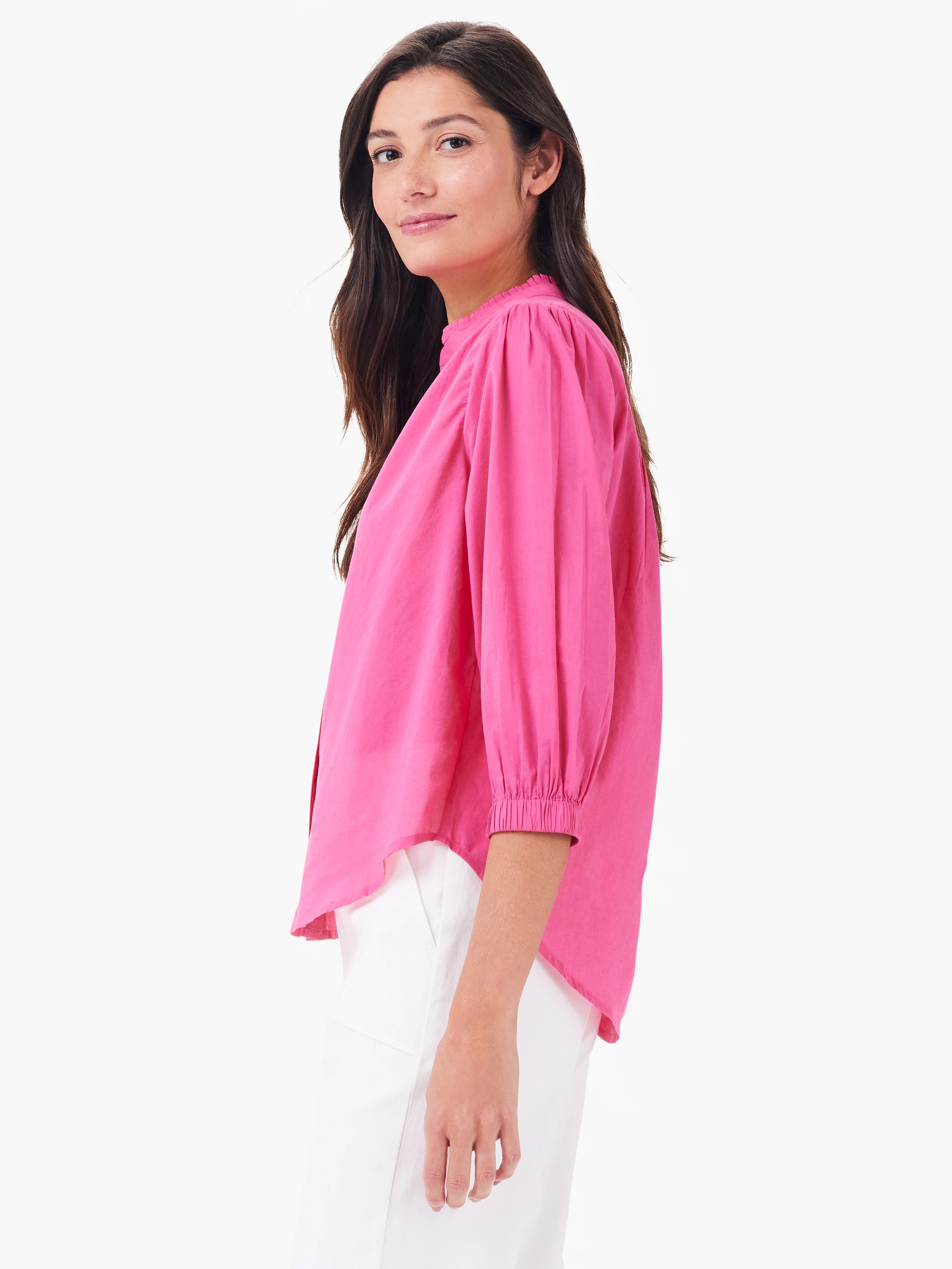 Bright pink cotton shirt with ruffled collar, puffed 3/4 sleeves with elastic cuffs, and a curved hem.