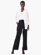 Off-white crepe drape tank with a soft draped neckline.