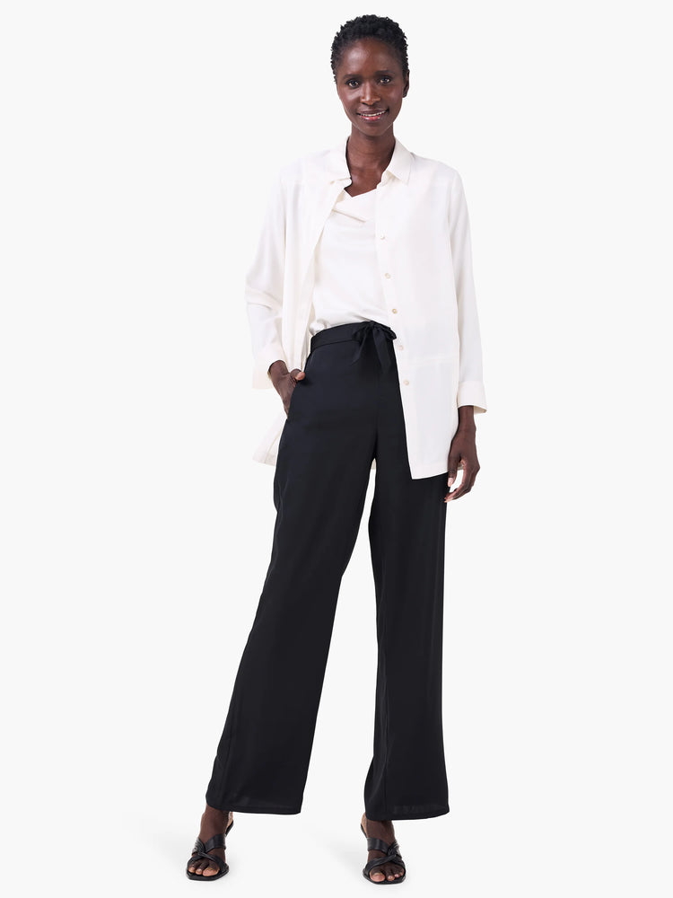 Off-white crepe drape tank with a soft draped neckline.