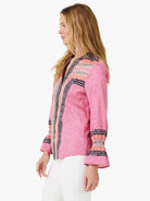 Pink top with navy & light pink dotted stripes, a zig-zag texture, and ruffled cuffs.