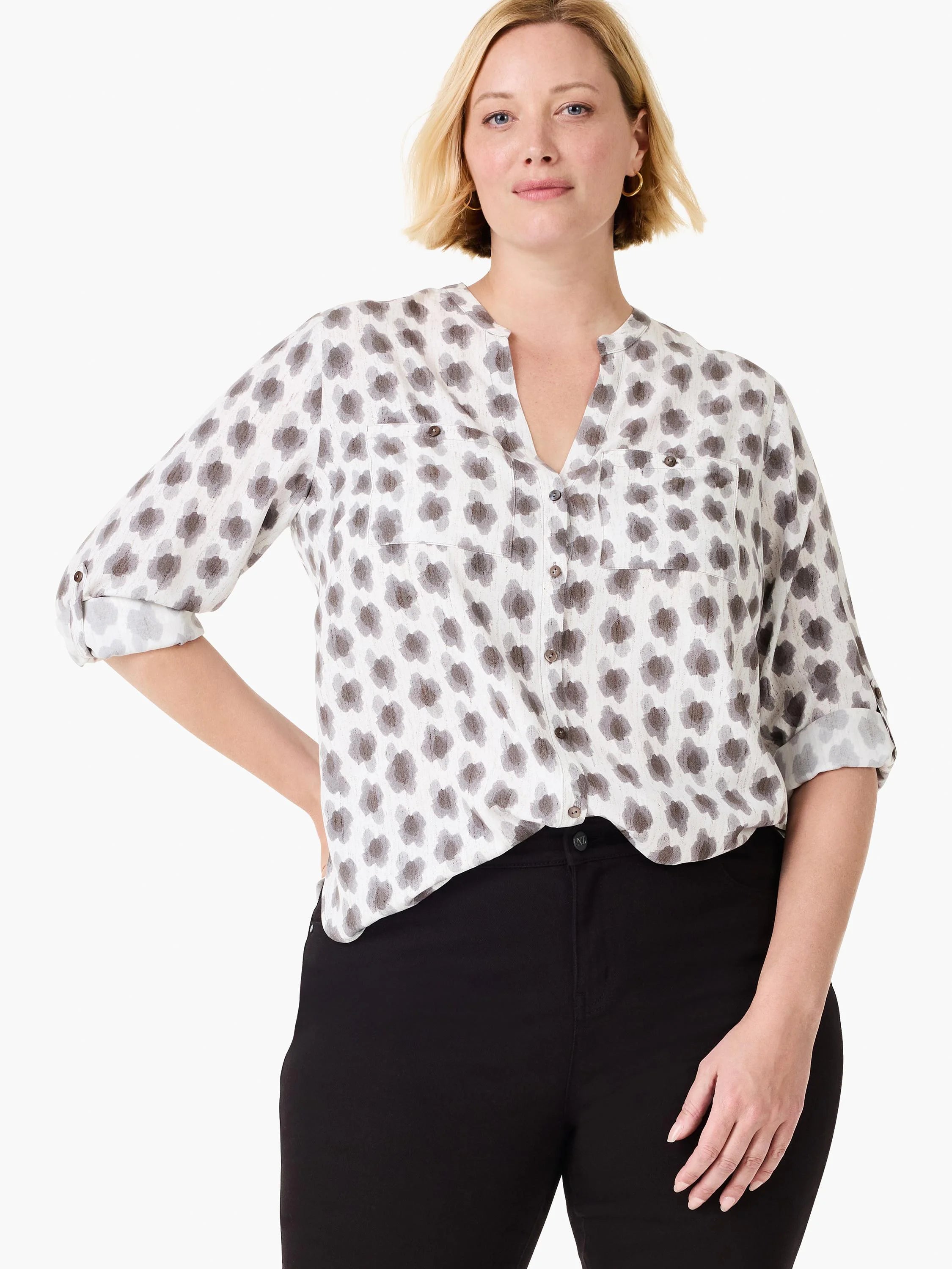 White button-down shirt with grey-brown clover stamp pattern, V-neck, chest pockets, and rolled 3/4 sleeves.
