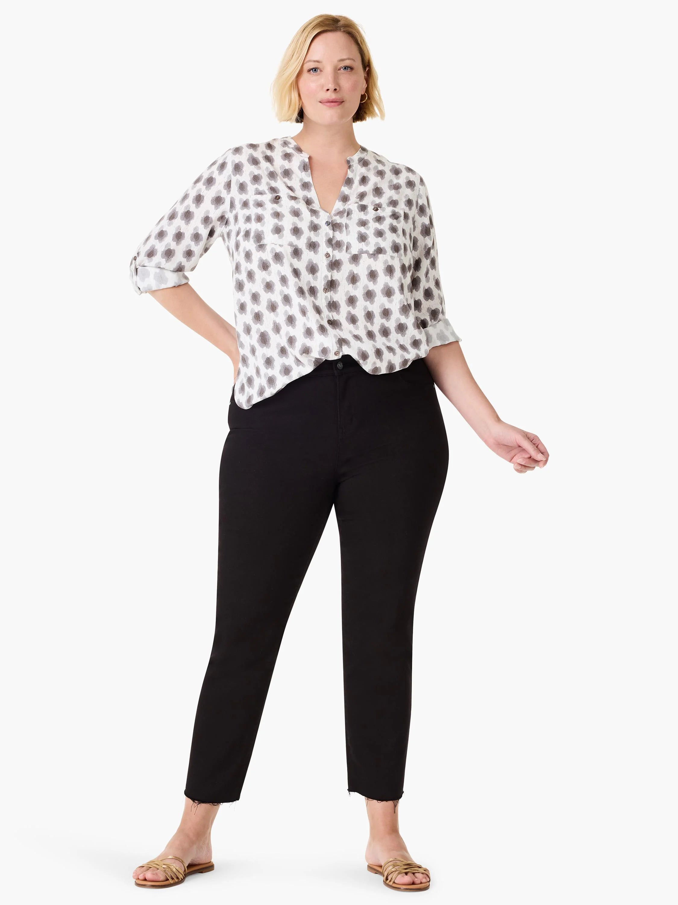 White shirt with gray clover stamp pattern, V-neck, roll-tab sleeves, and chest pockets.