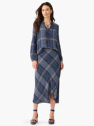 Blue and beige plaid top and asymmetrical midi skirt.  The top has a tie neckline.