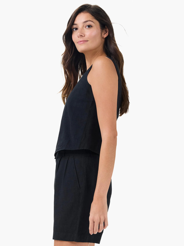 Black linen vest and shorts set. Sleeveless, cropped vest with a relaxed fit.  Shorts have a waistband and pockets.