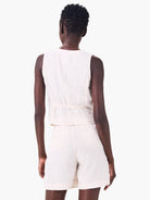 Off-white linen sleeveless vest and shorts.  Elastic waistband detail on vest.  Rear view.