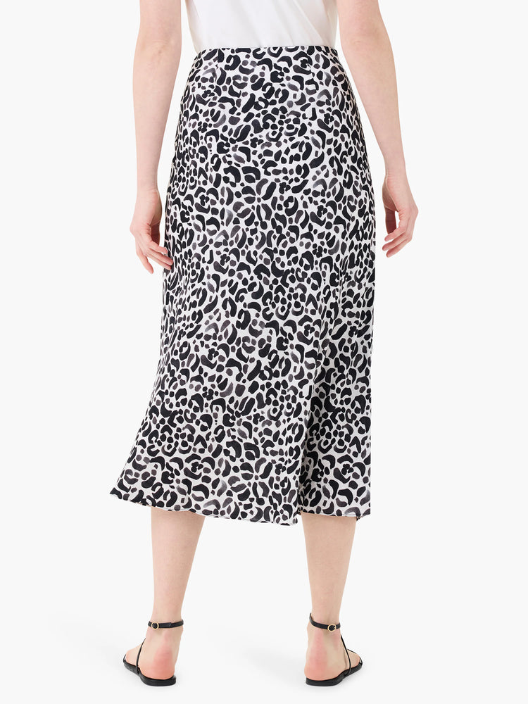 Mid-length slip skirt in off-white with a black and gray animal print.