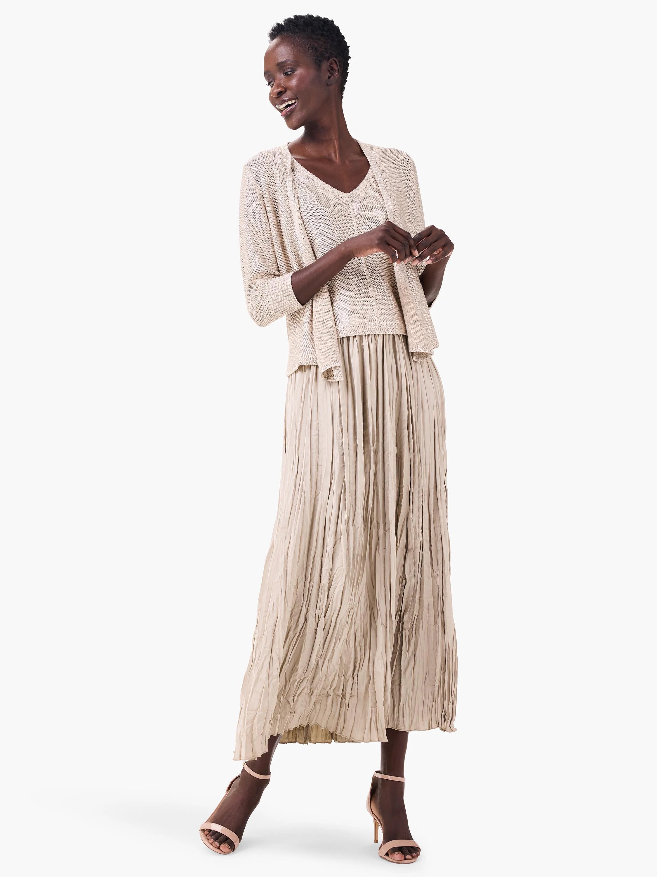 Light beige maxi Crinkle Crush skirt, featuring deep, uneven vertical folds.